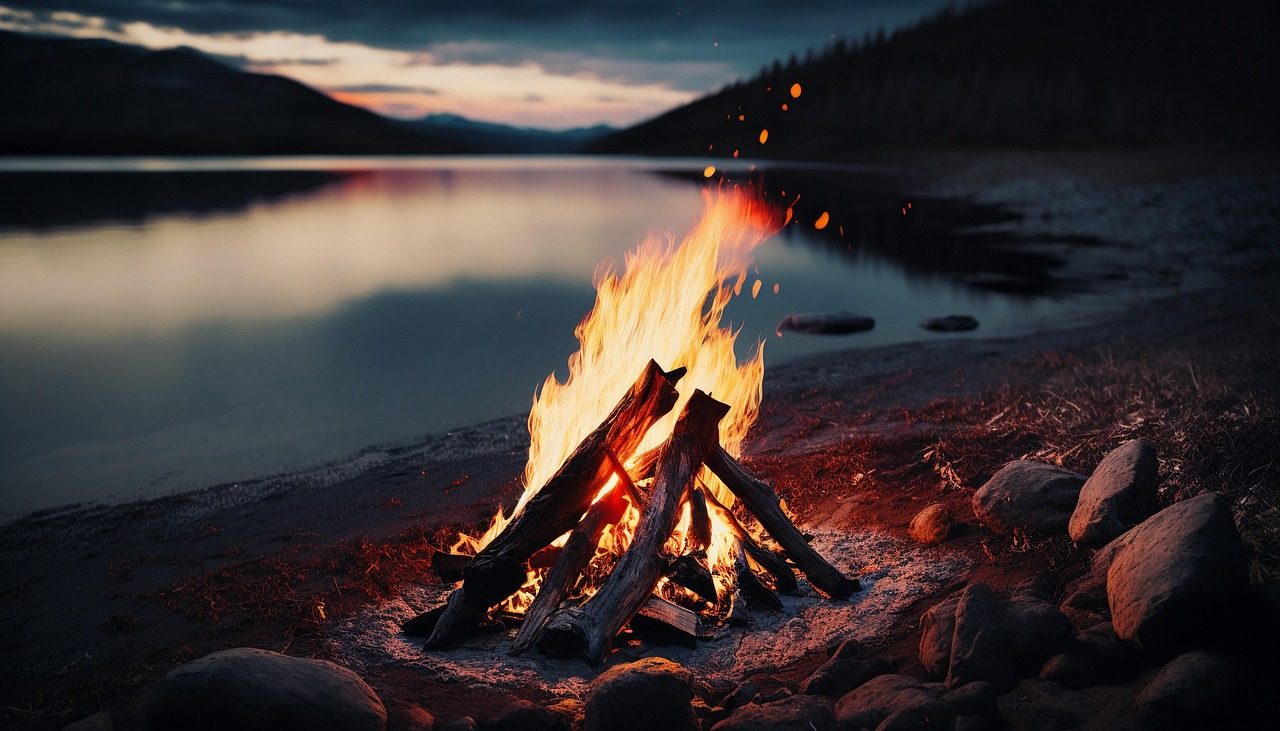 Friends telling scary stories around a campfire at night