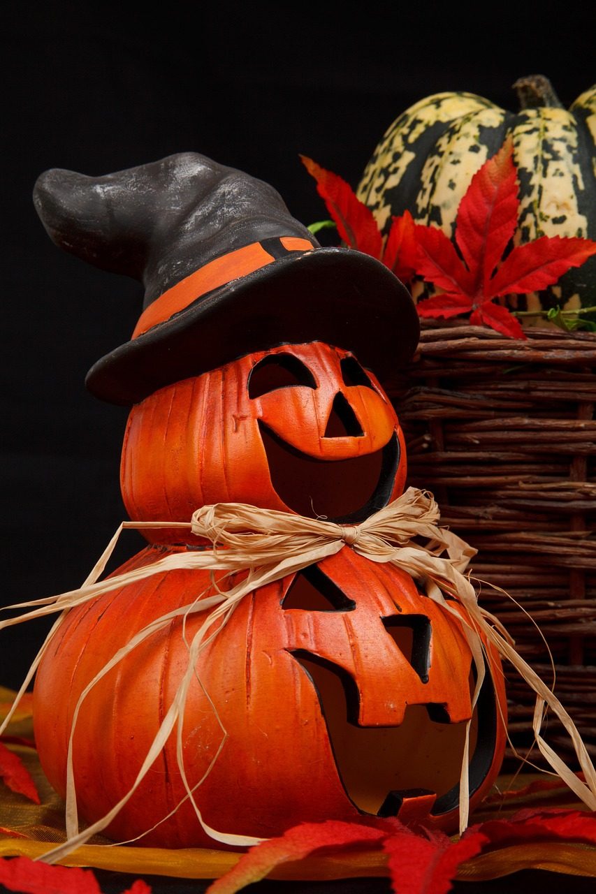 Decorated Halloween party table with snacks and candles